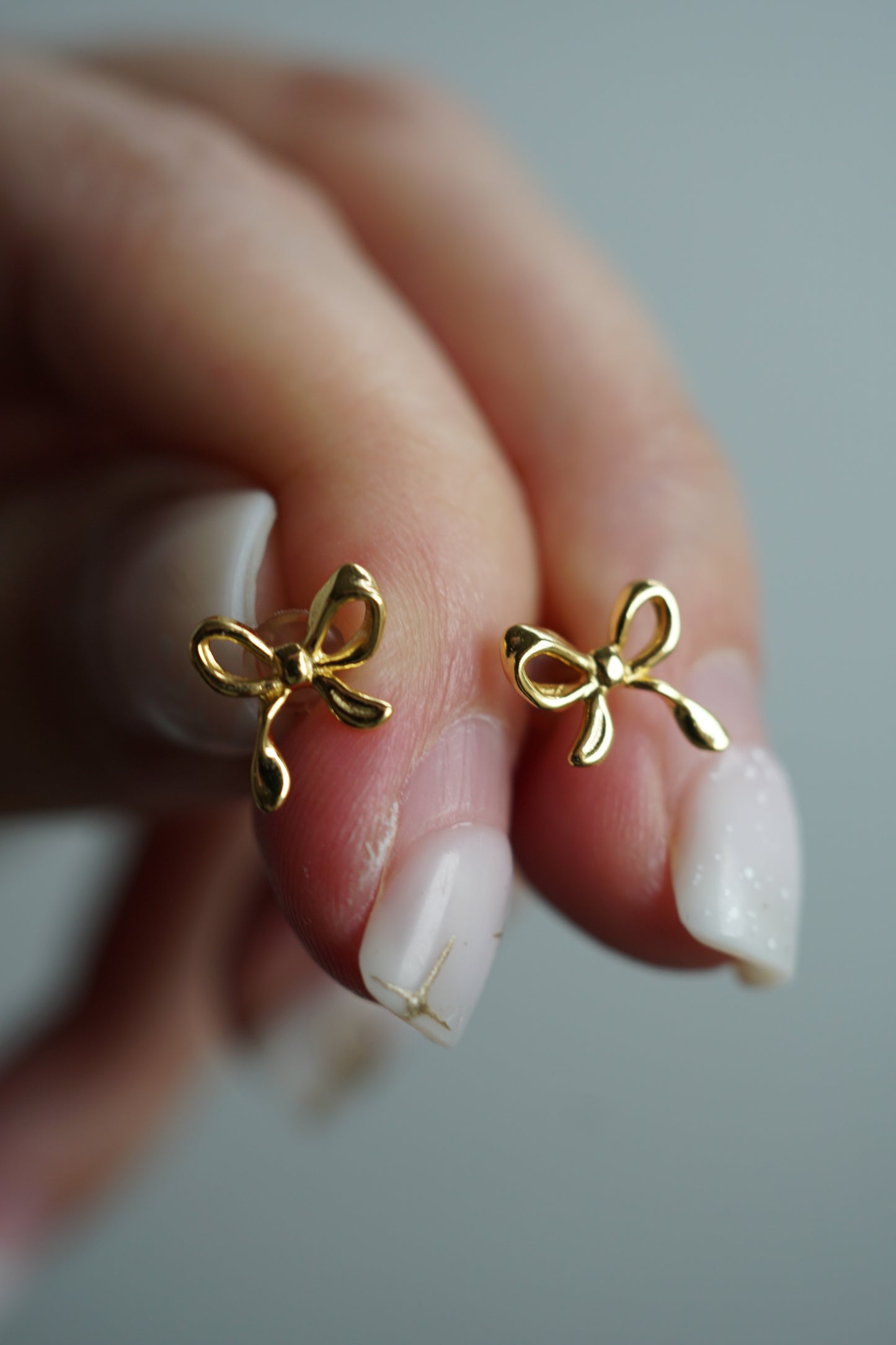 Tina tiny bow gold earrings